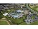 Community pool with expansive deck, playground, and residential homes at 8823 Interlocking Ct, Davenport, FL 33896