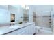 Double vanity bathroom with a large shower at 8823 Interlocking Ct, Davenport, FL 33896