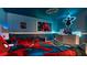 Themed bedroom with two twin beds and TV at 8823 Interlocking Ct, Davenport, FL 33896