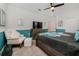 Bedroom with large bed and sitting chair at 8823 Interlocking Ct, Davenport, FL 33896