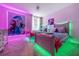 bedroom with Frozen theme, twin beds, and colorful LED lighting at 8823 Interlocking Ct, Davenport, FL 33896