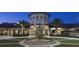 Elegant community center with a central fountain and palm trees at 8823 Interlocking Ct, Davenport, FL 33896