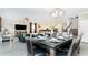 Open concept dining room with large table and seating for eight at 8823 Interlocking Ct, Davenport, FL 33896