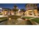 Elegant fountain in community courtyard at night at 8823 Interlocking Ct, Davenport, FL 33896