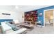 Game room with sectional sofa and large TV at 8823 Interlocking Ct, Davenport, FL 33896