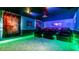 Home theater with LED lighting and comfortable seating at 8823 Interlocking Ct, Davenport, FL 33896