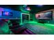Home theater with LED lighting and comfortable seating at 8823 Interlocking Ct, Davenport, FL 33896