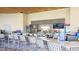 Outdoor bar with seating and multiple TVs at 8823 Interlocking Ct, Davenport, FL 33896