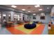 Bright and cheerful playroom with tables and toys at 8823 Interlocking Ct, Davenport, FL 33896