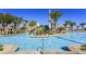 Relaxing pool area with a waterslide and plenty of lounge space at 8823 Interlocking Ct, Davenport, FL 33896