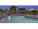 Lazy river at night with ambient lighting and lush landscaping at 8823 Interlocking Ct, Davenport, FL 33896
