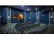 Community theater room with large screen and seating at 8823 Interlocking Ct, Davenport, FL 33896