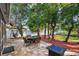 Relaxing patio area with fire pit and seating for multiple guests at 9302 Bay Vista Estates Blvd, Orlando, FL 32836