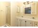 Clean bathroom with shower, double vanity, and mirror at 165 Moss Dr, Debary, FL 32713