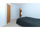 Bright bedroom with light blue walls and a view of another room at 165 Moss Dr, Debary, FL 32713