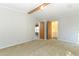 Primary bedroom with bathroom access and neutral decor at 165 Moss Dr, Debary, FL 32713