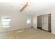 Large bedroom with ample closet space and neutral wall colors at 165 Moss Dr, Debary, FL 32713
