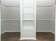 Walk-in closet with shelves and hanging rods for storage at 165 Moss Dr, Debary, FL 32713