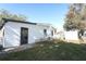 White single-wide mobile home with fenced yard at 165 Moss Dr, Debary, FL 32713