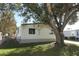 Mobile home exterior with large tree in yard at 165 Moss Dr, Debary, FL 32713