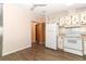 Kitchen with white appliances and wood cabinets at 165 Moss Dr, Debary, FL 32713