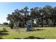 playground with swings and slides at 165 Moss Dr, Debary, FL 32713