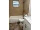 Clean bathroom featuring a bathtub and updated tile at 1730 N Orange St, Mount Dora, FL 32757