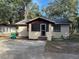 Charming bungalow home with a spacious front yard and mature trees at 1730 N Orange St, Mount Dora, FL 32757