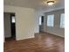 Spacious living area with wood flooring and plenty of natural light at 1730 N Orange St, Mount Dora, FL 32757