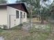 Side yard with chain link fence and access gate at 1730 N Orange St, Mount Dora, FL 32757