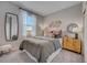 Bright bedroom with a queen bed, dresser, and large mirror at 3571 Dahlia Dr, Lake Hamilton, FL 33851