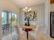 Casual dining area with round wooden table and four upholstered chairs at 3571 Dahlia Dr, Lake Hamilton, FL 33851