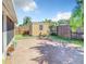 Private backyard with paver patio, shed, and fire pit at 4217 Sky Flower Ln, St Cloud, FL 34772