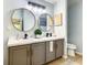 Modern bathroom with dual sinks and updated fixtures at 4217 Sky Flower Ln, St Cloud, FL 34772