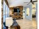 Living room showcasing a rustic wood feature wall and hardwood floors at 4217 Sky Flower Ln, St Cloud, FL 34772