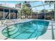 Inviting kidney-shaped pool with screened enclosure and patio at 4217 Sky Flower Ln, St Cloud, FL 34772