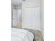 Bedroom with a large closet and access to another room at 4701 New Orleans Cv, Oviedo, FL 32765