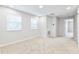 Spacious bedroom with two windows and access to hallway at 4701 New Orleans Cv, Oviedo, FL 32765