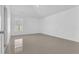Simple bedroom with tile floors and a window at 610 Crane Dr, Poinciana, FL 34759