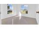 Well-lit bedroom with tile floors and two windows at 610 Crane Dr, Poinciana, FL 34759