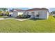 House exterior showcasing a neat lawn and driveway at 610 Crane Dr, Poinciana, FL 34759