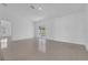 Spacious living room featuring tile flooring and access to a patio at 610 Crane Dr, Poinciana, FL 34759