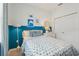 Bedroom with blue walls and a turtle-themed bedding set at 920 Pearlwood Loop, Eagle Lake, FL 33839