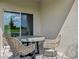 Covered patio with wicker furniture and view of backyard at 920 Pearlwood Loop, Eagle Lake, FL 33839