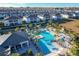 Aerial view of community pool, homes, and landscape at 1264 Challenge Dr, Davenport, FL 33896