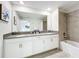 Bathroom with double vanity, modern finishes, and a bathtub at 1264 Challenge Dr, Davenport, FL 33896