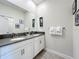 Double vanity bathroom with modern finishes at 1264 Challenge Dr, Davenport, FL 33896