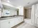 Bathroom with double vanity, modern finishes, and a bathtub at 1264 Challenge Dr, Davenport, FL 33896