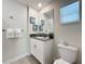 Clean bathroom with white vanity, gray countertop and a toilet at 1264 Challenge Dr, Davenport, FL 33896