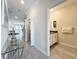 Small half bathroom with dark vanity and seahorse decor at 1264 Challenge Dr, Davenport, FL 33896